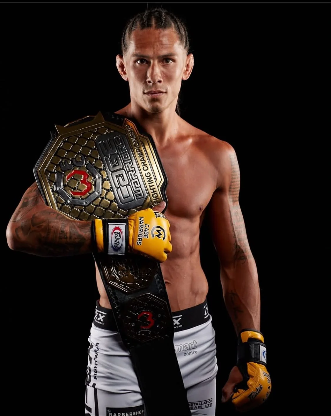 Sam Creasey holding the Cage Warriors championship belt