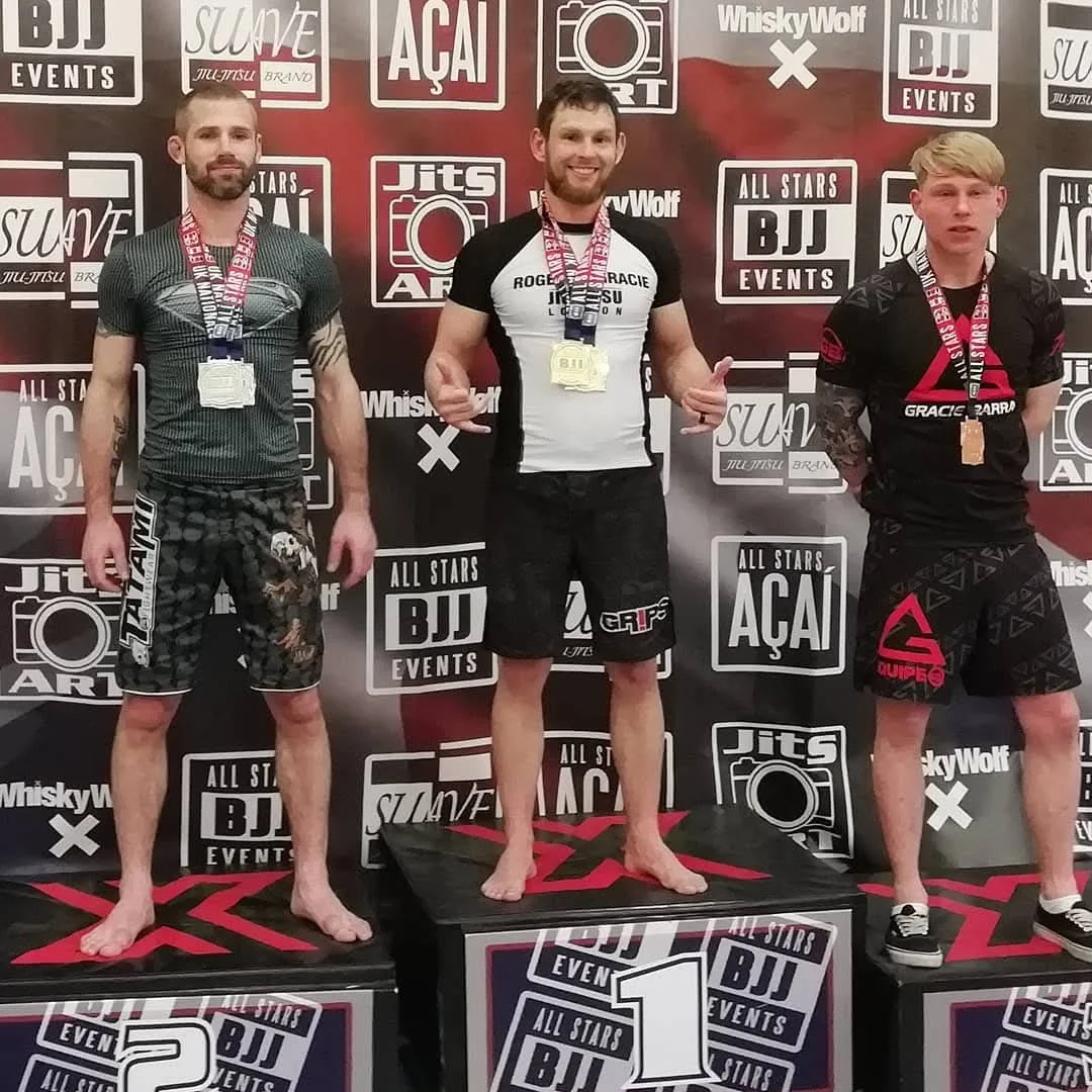Steve on a grappling competition podium